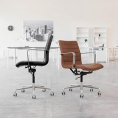 two office chairs sitting next to each other