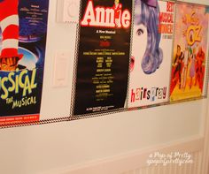 several movie posters are hanging on the wall