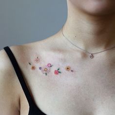 a woman's chest with flowers on it