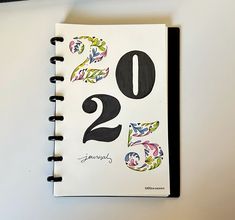 a spiral notebook with the number twenty two printed on it