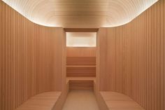 the inside of a sauna with two benches and no one sitting in it,