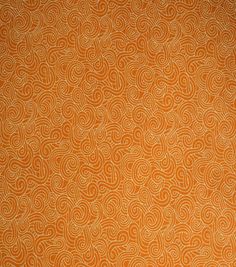 an orange and white wallpaper with swirls on the back ground, as well as a brown background