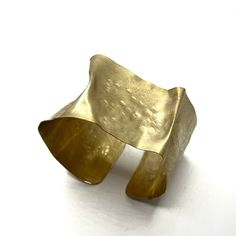 Brass Bracelet - This flexible cuff is crafted from brass thats been folded, hammered, sanded, and brushed with care. The result is a wearable work of art with a soft, glowing matte finish. Its flexibility allows it to be worn in a variety of ways, on a variety of wrists sizes. Brass Cuff Bracelet, Metal Cuff Bracelet, Wide Cuff Bracelets, Brass Cuff, Brass Bracelet, Artful Home, Metal Shop, Wide Cuff, Roxy