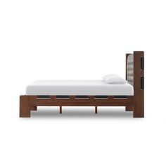 the bed frame is made out of wood and has white sheets on top of it