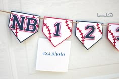 baseball themed banner hanging on the wall with name and number displayed in front of it