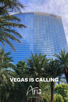 the vegas is calling sign in front of palm trees and a tall building with words on it