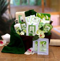 a basket filled with lots of green and white items sitting on top of a table