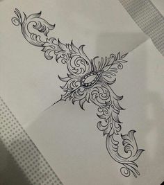 an artistically designed piece of paper that is on top of a sheet of paper