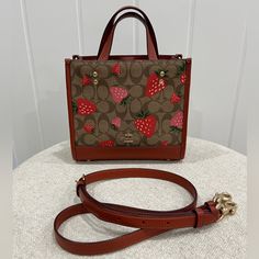 Coach Dempsey 22 Bag In Cute Red And Pink Strawberry Print. Top Handle And Crossbody Strap Included. In Very Good Condition. Comparable Value $398. Coach Strawberry, Pink Strawberry, Bags Coach, Strawberry Print, Print Top, Crossbody Strap, Coach Bags, Top Handle, Bag Lady