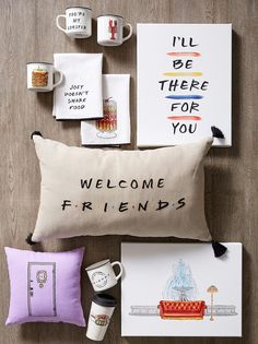 various items are arranged on the floor including pillows, coffee mugs and greeting cards