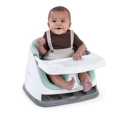 a baby is sitting in a high chair