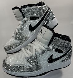 Step up your Jordans game with these fully blinged Jordan 1 mids. These shoes are a great addition for prom, a birthday, a wedding, a night on the town, or your  next event! These shoes can be customized to the colors of your choosing. Not looking for Jordan 1's? Message me with your shoe choice. I'd love to create the custom shoe of your dreams. *Disclaimer We are not associated with the brand, I only hand customize the shoes using rhinestones. Women’s Nike Jordans, Bedazzled Jordan Ones, Shoes Sneakers Jordans Women, Bedazzled Nike Shoes, Nike Jordan Shoes Women, Nike Shoes Customized, Badazzel Shoes, Teen Shoes Nike, Swag Shoes Nike