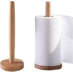 two rolls of toilet paper next to each other on a wooden holder with a wood handle