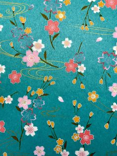 a blue background with pink and yellow flowers on it