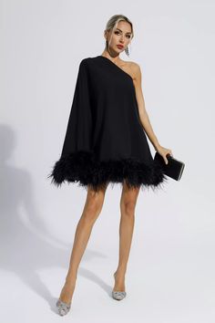 Add cuteness and elegance to your wardrobe with the Ailani Black Feather Trim One Shoulder Mini Dress! The one-shoulder style design with long sleeves adds a sense of fashion and luxury. The skirt is dotted with feathers, which look fluffy and adorable. Wear heels or boots to create a look that's unique to you. Perfect for cocktails or parties.  Dress Length: Approx 90cm Materials: 70% Polyester, 30% Cotton Gentle Dry Clean Only  Model is 5 ft 7 and wears size S  Colour may vary due to lighting One Shoulder Party Dress With Feather Trim, Elegant Asymmetrical Dress For Winter Party, Chic One-shoulder Mini Dress For Winter, Winter Off-shoulder Cocktail Dress, Winter Formal Off-shoulder Dress, Winter Cocktail Off-shoulder Dress, Party Season Dresses With Feather Trim, Winter Evening Dress With Asymmetrical Neckline, Party Season Feather Trim Evening Dress