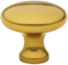 an image of a golden cabinet knob on a white background with clipping for text