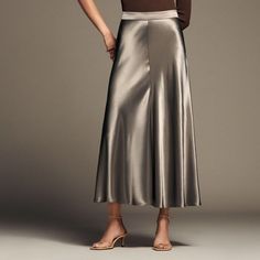 Beautiful And Timeless Satin Effect Midi Skirt By Zara In Size Medium In Taupe 100% Viscose Fabric Is Soft And Shiny Giving The Skirt An Elegant Appearance. Skirt Contains Side Zipper Enclosure Versatile And Can Be Dressed Up Or Down. Wear With A T-Shirt Or Tank And Sandals. Or Dress Up For A Party Or Night Out. Measurements: Waist: 28-29" Length: 37" Ships From Smoke And Pet Free Home. Casual Long Satin Skirt, Casual Satin Long Skirt, Silk A-line Skirt With Relaxed Fit, Silk A-line Relaxed Skirt Bottoms, Zara Evening Midi Skirt, Elegant Full Length Lined Skirt, Zara Long Pleated Skirt, Elegant Full Length Solid Color Skirt, Zara Formal Skirt For Spring