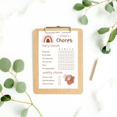 a clipboard with a daily chore on it next to some leaves