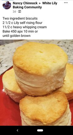 three biscuits stacked on top of each other in front of a red plate with white frosting