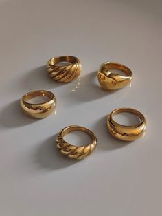 We offer chunky gold rings at affordable prices. Since chunky rings are so popular, I made a special collection for them. Large dome rings, chunky croissant rings, double dome rings, chunky love rings. As a beautiful stainless steel-based gold band, it lasts forever and will always look good. A single ring is stylish enough, but a couple does look very fancy together. ♥ SIGN UP for 10% OFF your first order: https://bit.ly/3olIlWf ♥ DETAILS - Materials: Stainless steel, 18k gold plating. - Nickel Bulky Rings Women, Chunky Jewelry Rings, Gold Chunky Rings Aesthetic, Statement Rings Gold, Gold Thick Ring, Gold Rings Thick, Chunky Gold Rings Vintage, Thick Rings For Women, Classy Gold Rings