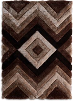 a brown and white rug with an abstract design on the bottom, in different colors