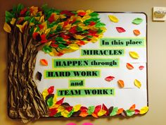 a bulletin board decorated with paper leaves and a tree that says, in this place braces happen through hard work and team work