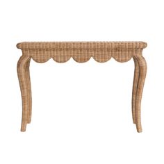 a wicker table with scalloped legs