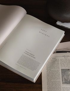 an open book sitting on top of a wooden table