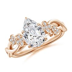 a rose gold ring with an oval cut diamond in the center and side stones on each band