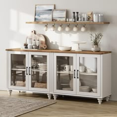 a white cabinet with glass doors and shelves