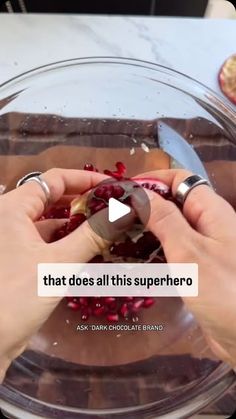 someone is cutting up some food in a glass bowl with a knife on top of it