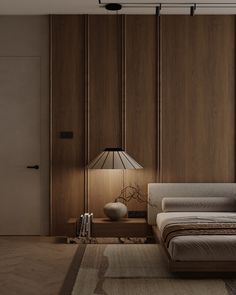 a modern bedroom with wood paneling and a bed in the corner, along with a lamp