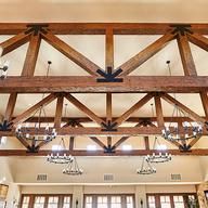 a large open room with chandeliers hanging from the ceiling