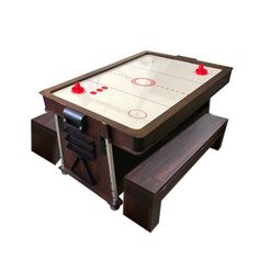 an air hockey table with two benches