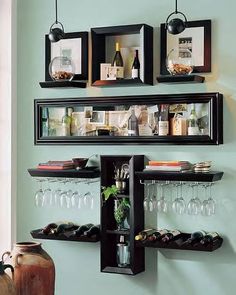 an open magazine with wine glasses and bottles on the shelf next to each other,