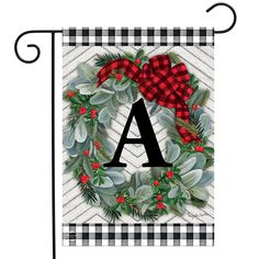 a christmas wreath with the letter a on it