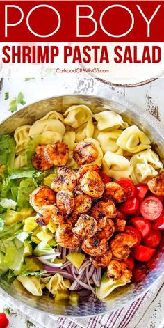 shrimp pasta salad in a bowl with tomatoes and lettuce