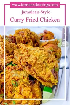 a white plate topped with fried chicken on top of a table