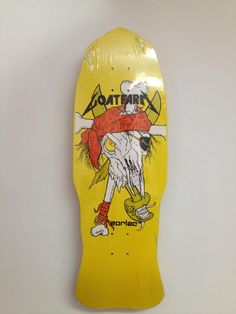 a yellow skateboard hanging on the wall