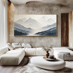 a living room with a large painting on the wall and white furniture in front of it