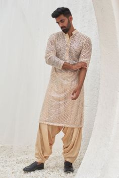 Beige full sleeves kurta with all over leaf swerve tonal sequin embroideries. Paired with a patiala. - Aza Fashions Traditional Dress For Men Indian, Kurta With Dhoti Pants For Men, Kurta Patiala For Men, Dhoti Outfit Men, Wedding Kurta For Men Style, Mens Kurta Designs Wedding, Stylish Kurta Pajama For Men, Wedding Guest Dress Men, Kurtas For Mens