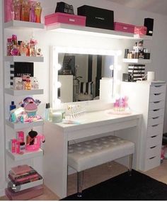 a white desk topped with a mirror next to a shelf filled with makeup and other items