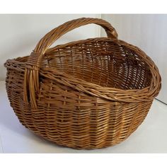 an empty wicker basket sitting on the floor