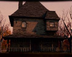 an old wooden house in the woods at dusk