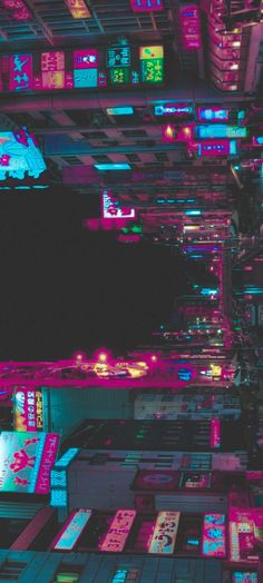 an image of a city at night that looks like it is lit up with neon lights