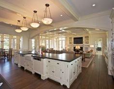 a large kitchen with an island in the middle