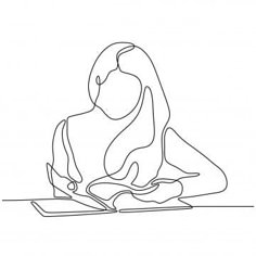 a woman sitting at a table with an open book in her lap and writing on the paper