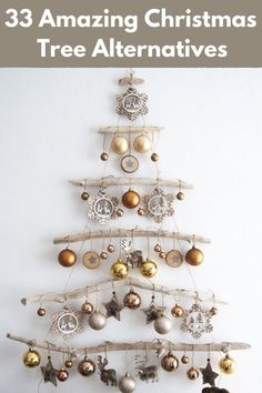 a christmas tree with ornaments hanging from it and the words 33 amazing christmas tree alternatives