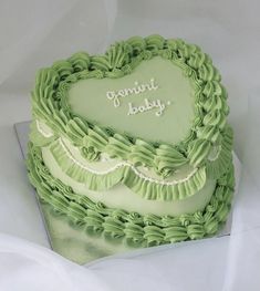 a heart shaped cake with the words forward baby written in frosting on it's side