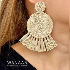 Iris Style Earrings / Handmade Boho Iraca Palm earrings Elevate your style with the unique beauty of handmade Colombian products. Wanaan proudly presents our handmade Iraca earrings. This is a true work of art that will leave lasting impressions and memories. These accessories are a stylish addition to your look. Skilled Colombian artisans meticulously crafted each earring using traditional techniques passed down through generations. Don't miss this opportunity to bring a piece of Colombian arti Bohemian Tassel Earrings For Beach, Bohemian Handwoven Earrings, Bohemian Beige Earrings For Vacation, Beige Bohemian Earrings For Vacation, Traditional Beaded Tassel Earrings For Beach, Handmade Dangle Tassel Earrings For Beach, Bohemian Woven Earrings For Vacation, Traditional Earrings For Beach Summer, Bohemian Handwoven Tassel Earrings For Summer